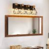 24" Modern Geometric 4-Light Vanity Light Fixture with Black Metal, Wooden Accents and Cage Lampshade for Bathroom, Bedroom, or Living Room (Bulb Not Included)
